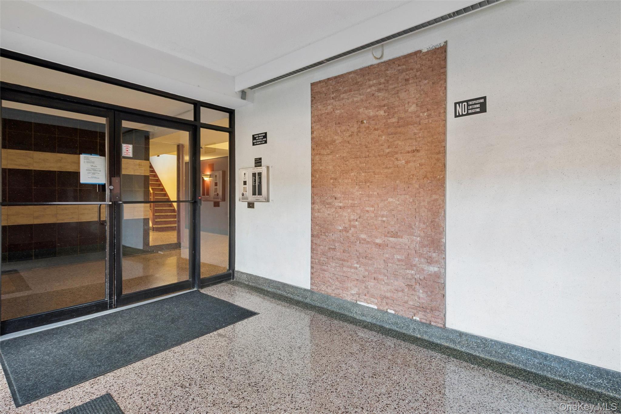 32-40 92nd Street, Unit 107 Queens, NY 11369 - Photo 14 of 16 an empty room with sliding door