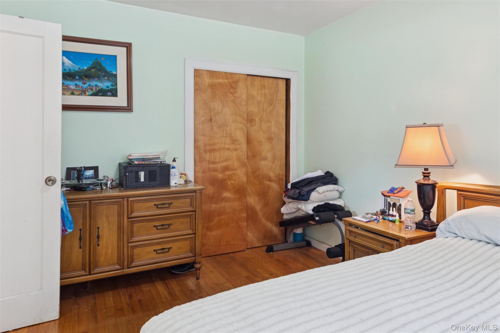 32-40 92nd Street, Unit 107 Queens, NY 11369 - Photo 10 of 16 a bed room with a bed and a dresser