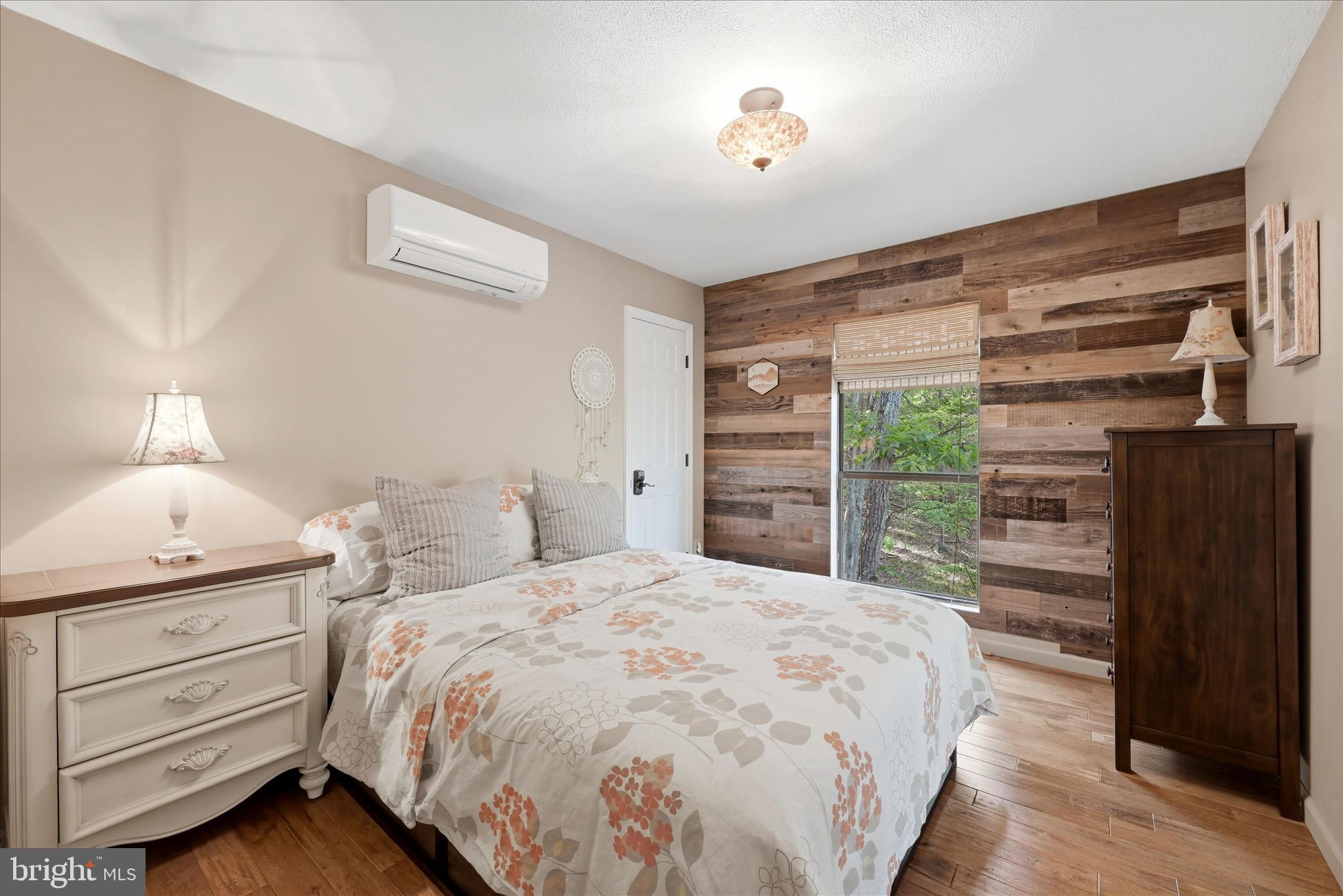 1856 Crossings View Road Paw Paw, WV 25434 - Photo 20 of 45 a bedroom with a bed and a dresser