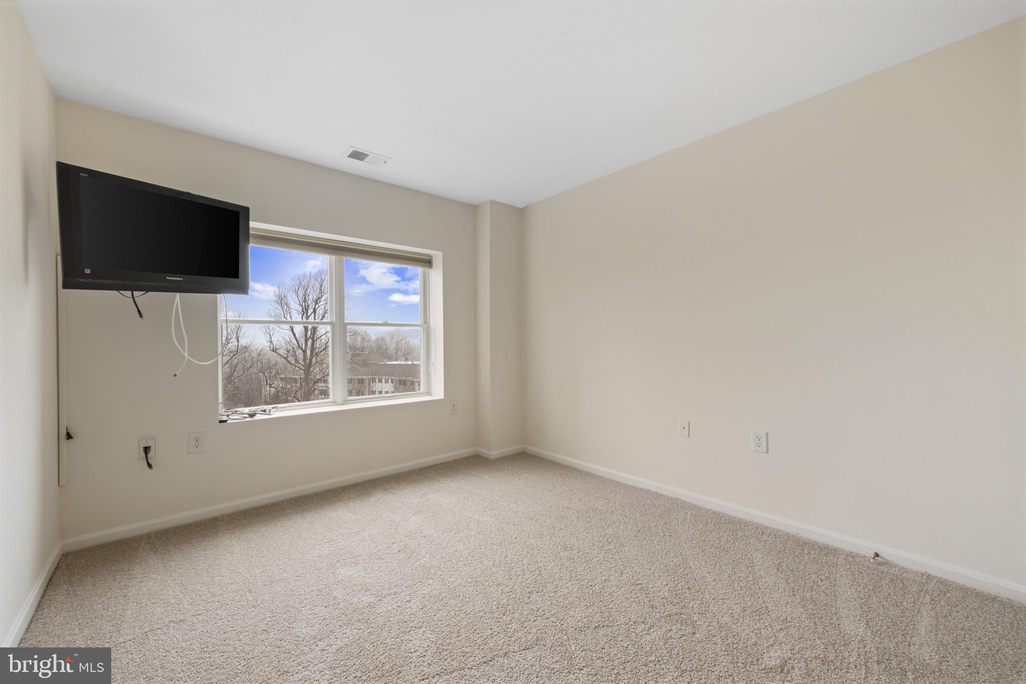 12246 Roundwood Road, Unit 707 Lutherville-Timonium, MD 21093 - Photo 17 of 24 2nd bedroom with TV