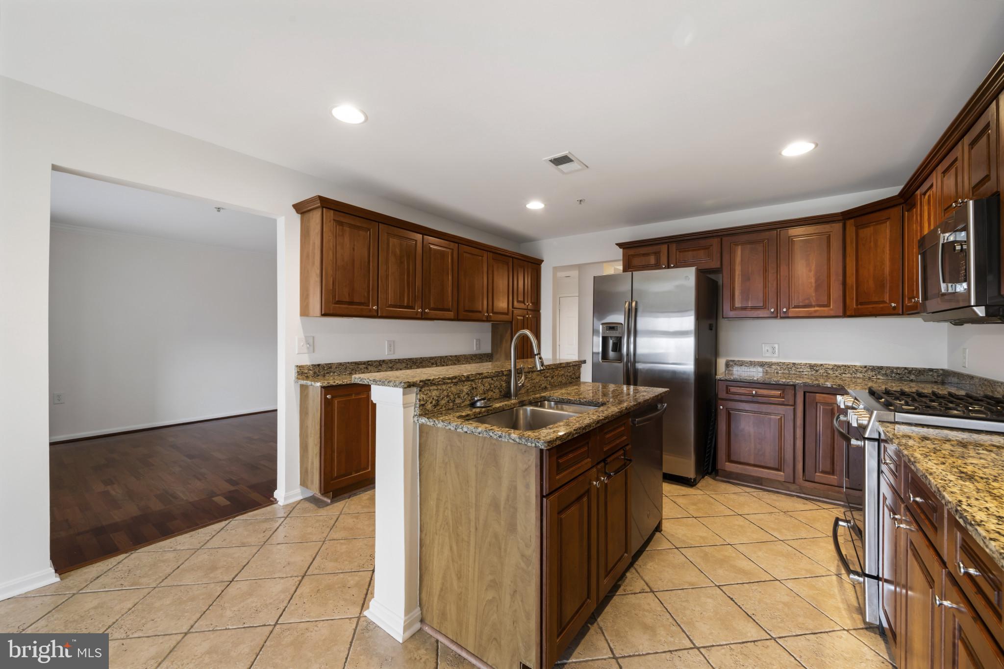 12246 Roundwood Road, Unit 707 Lutherville-Timonium, MD 21093 - Photo 9 of 24 Granite counters & stainless steel appliances