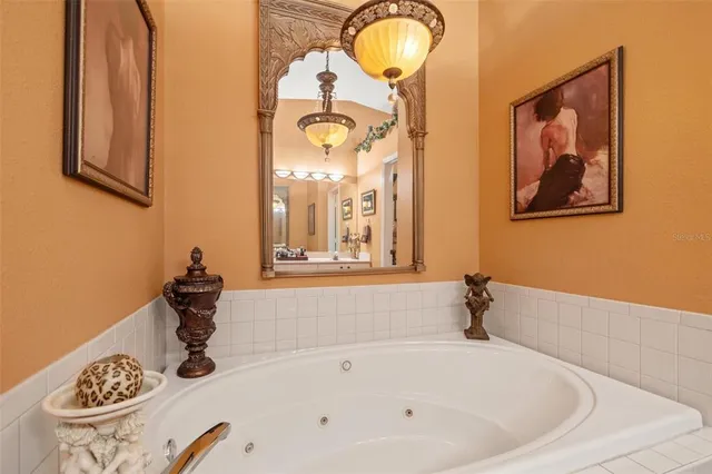 a bathroom with a tub and a window