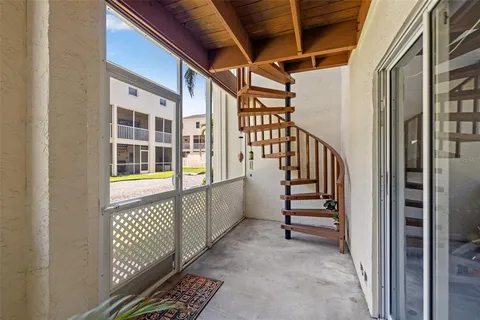 an aerial view of multiple houses with a yard