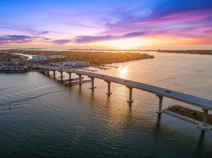 a view of a lake with beach and outdoor space