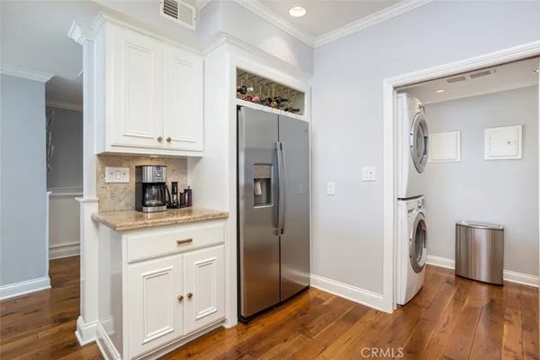 a kitchen with stainless steel appliances a refrigerator and cabinets