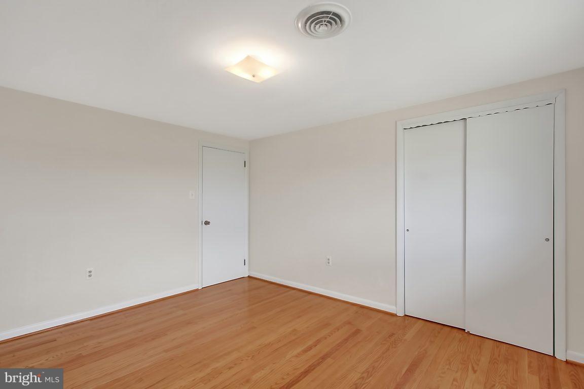 1900 White Hall Road White Hall, MD 21161 - Photo 11 of 21 Bedroom #1 with spacious closet and hardwood floor