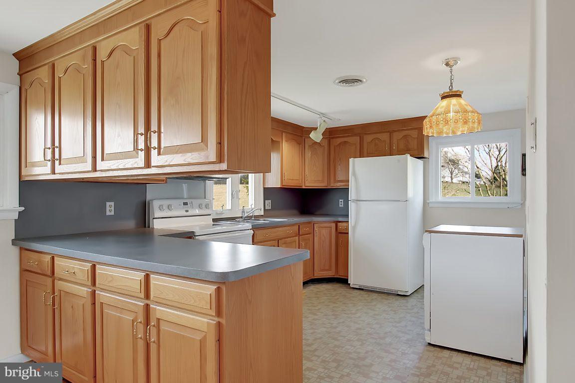 1900 White Hall Road White Hall, MD 21161 - Photo 4 of 21 U shaped kitchen with good plenty of cabinets