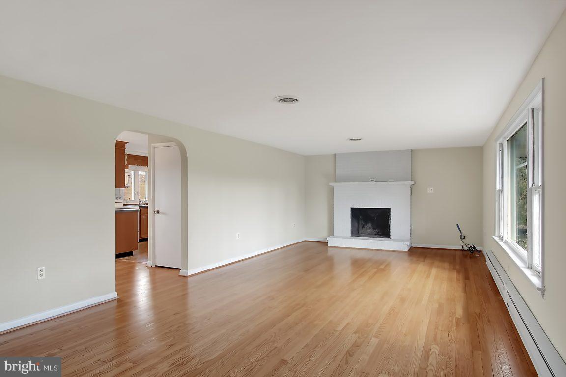 1900 White Hall Road White Hall, MD 21161 - Photo 8 of 21 Living room with fireplace