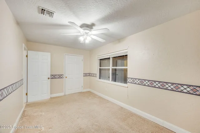 a view of a storage & utility room with closet dryer