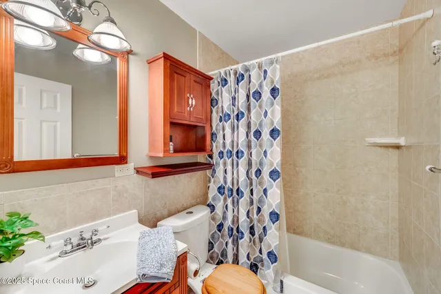 a bathroom with a sink a mirror and a bathtub