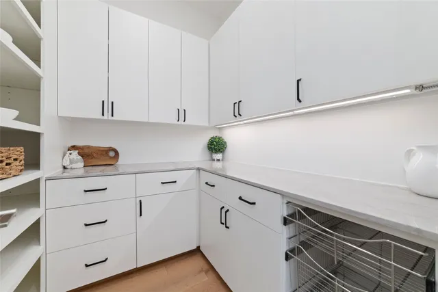 a kitchen with cabinets appliances