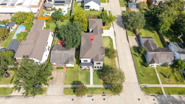 an aerial view of houses with outdoor space