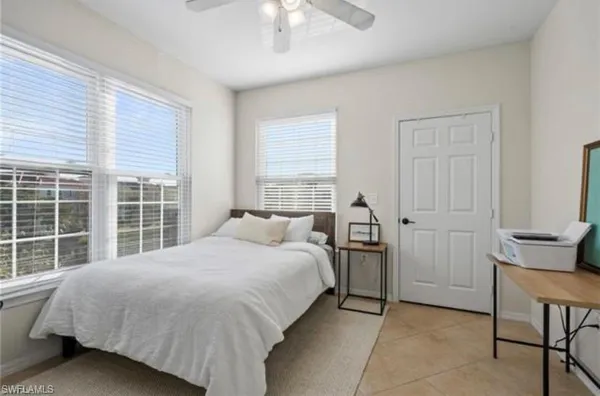 a bedroom with a bed and a table