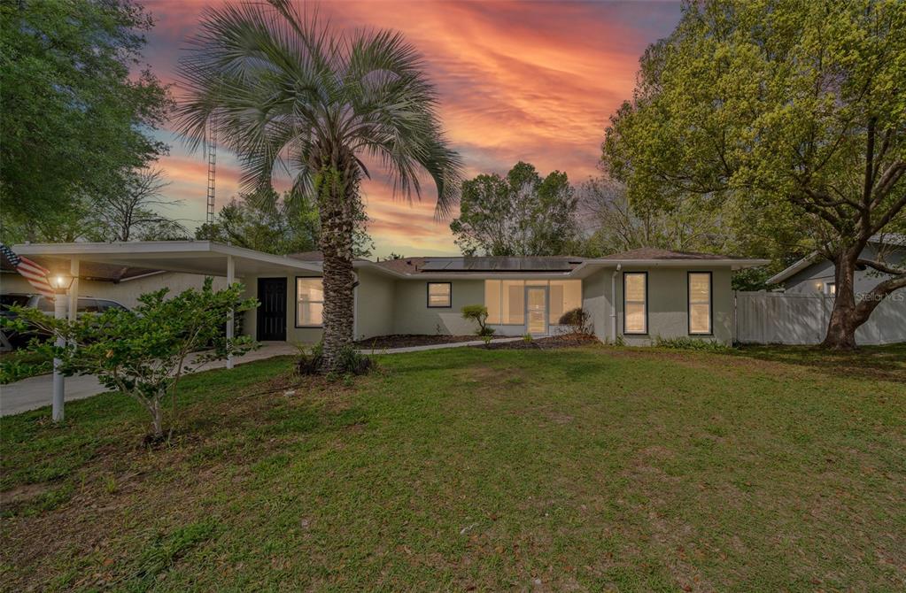 9318 Spring Terrace Ocala, FL 34472 - Photo 1 of 19 a front view of house with yard and green space