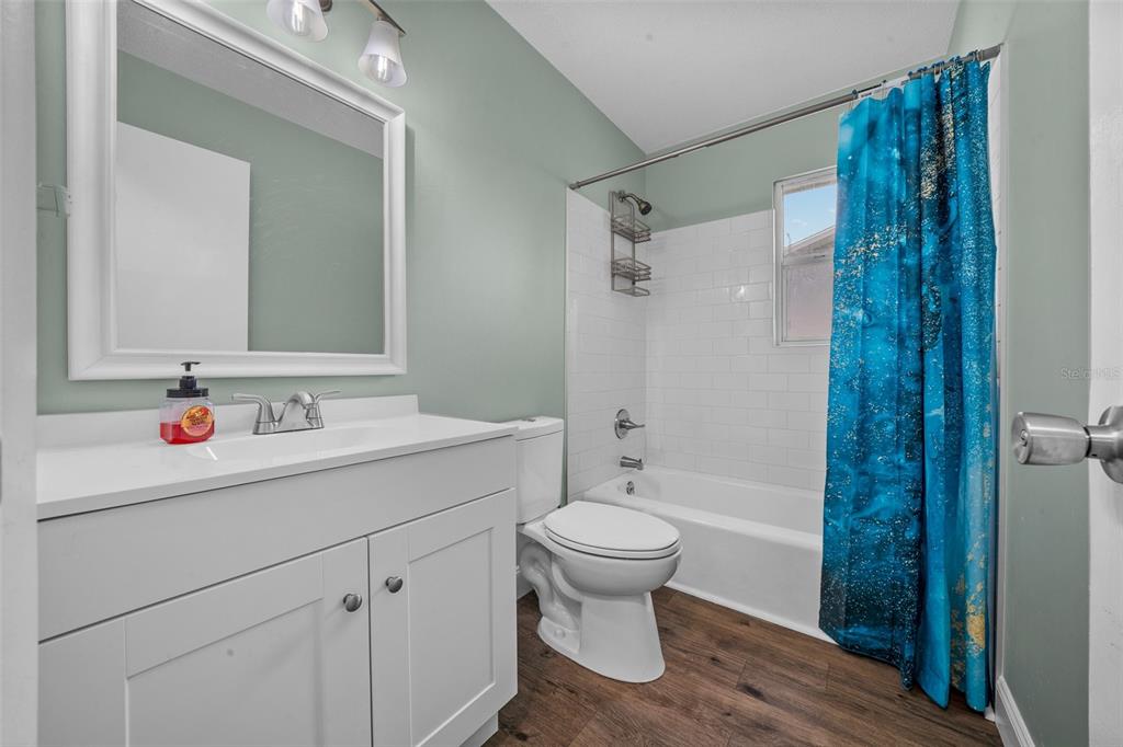 9318 Spring Terrace Ocala, FL 34472 - Photo 11 of 19 a bathroom with a sink toilet and shower