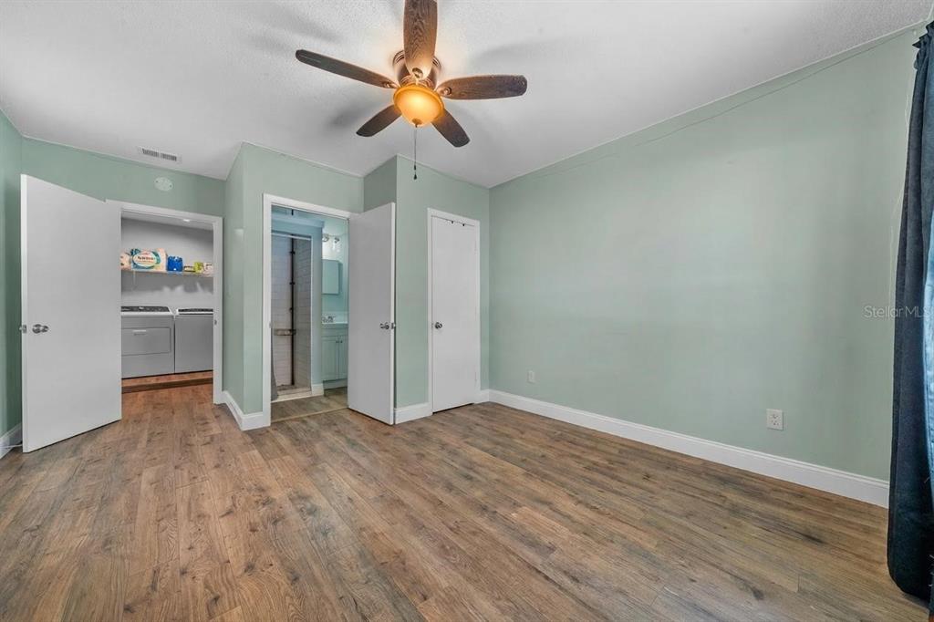 9318 Spring Terrace Ocala, FL 34472 - Photo 14 of 19 wooden floor in an empty room with a fan