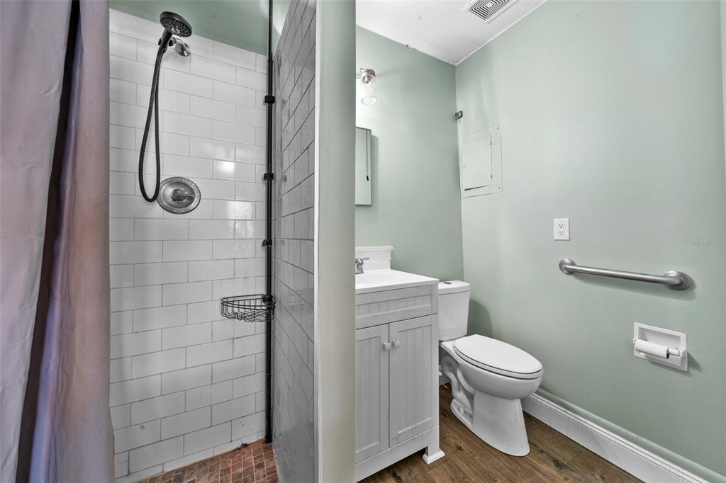 9318 Spring Terrace Ocala, FL 34472 - Photo 15 of 19 a bathroom with a toilet and shower