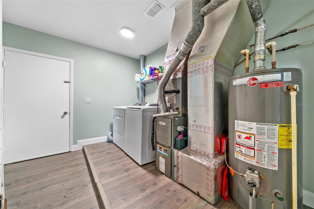 9318 Spring Terrace Ocala, FL 34472 - Photo 16 of 19 a utility room with dryer and washer