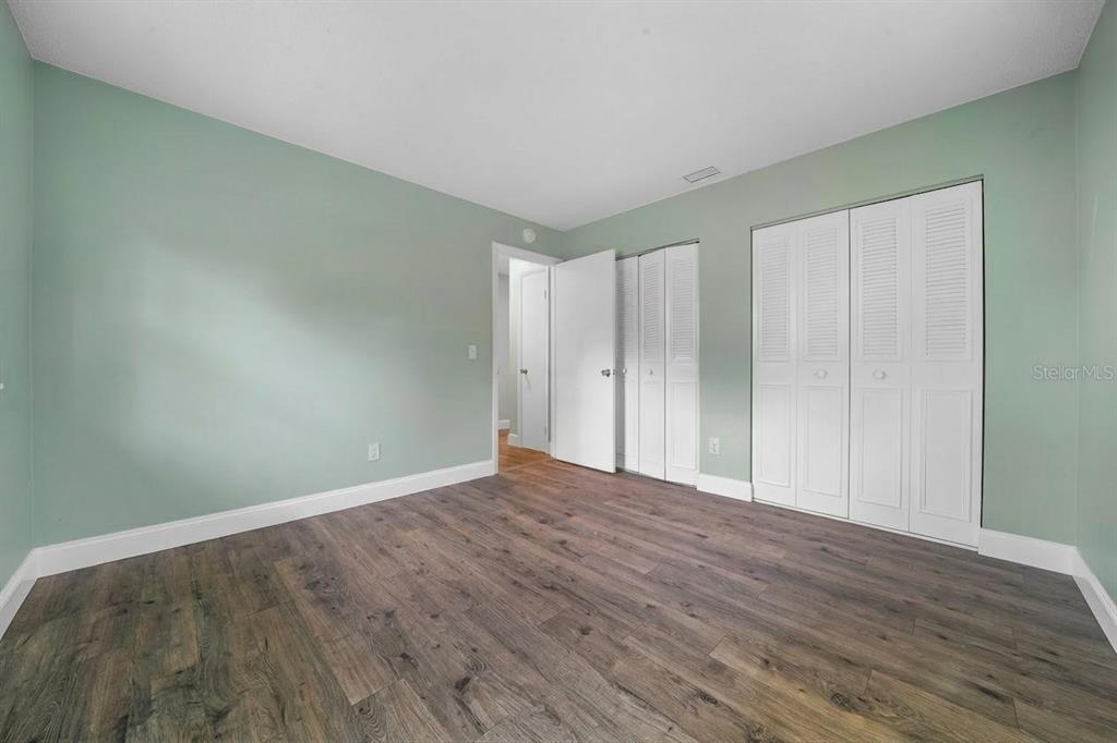 9318 Spring Terrace Ocala, FL 34472 - Photo 10 of 19 a view of an empty room with wooden floor