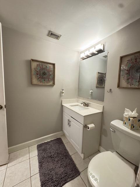 4969 Sable Pine Circle, Unit D1 West Palm Beach, FL 33417 - Photo 11 of 24 a bathroom with a toilet sink and mirror