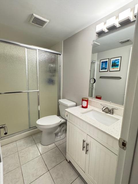4969 Sable Pine Circle, Unit D1 West Palm Beach, FL 33417 - Photo 13 of 24 a bathroom with a sink a toilet and a mirror