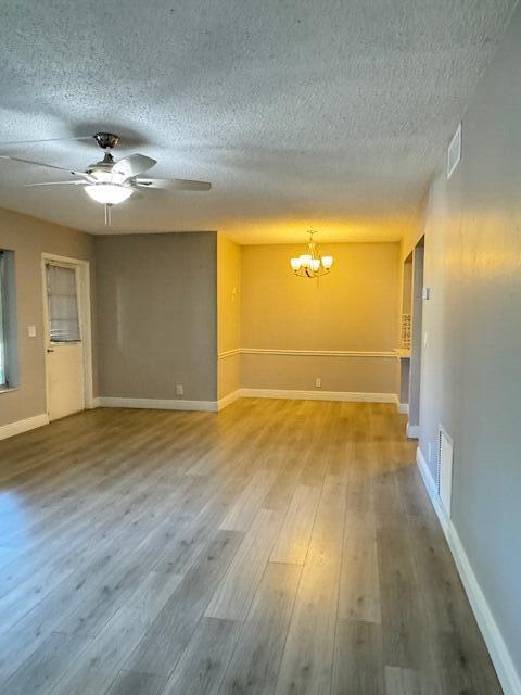4969 Sable Pine Circle, Unit D1 West Palm Beach, FL 33417 - Photo 8 of 24 wooden floor in an empty room with a window