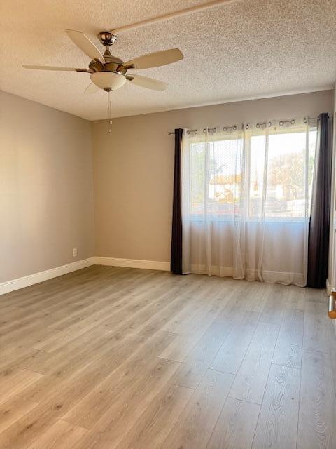 4969 Sable Pine Circle, Unit D1 West Palm Beach, FL 33417 - Photo 9 of 24 an empty room with wooden floor and windows