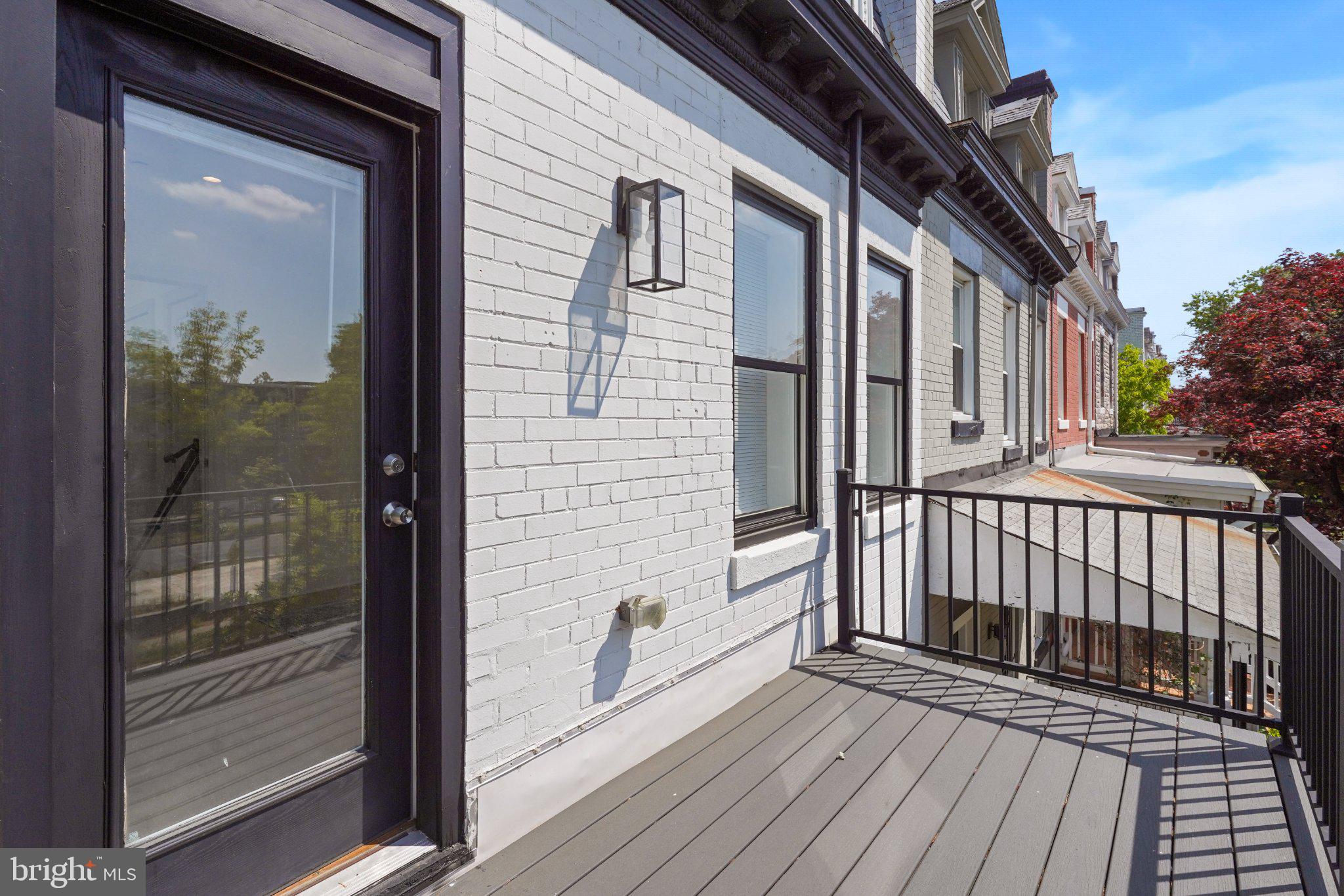 112 V Street Northeast Washington, DC 20002 - Photo 22 of 25 a view of a brick house with a wooden deck