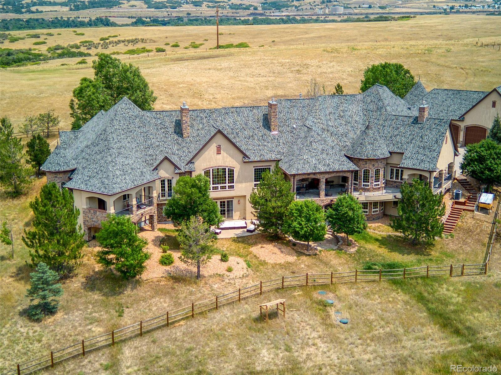 5740 Lambert Ranch Trail Sedalia, CO 80135 - Photo 2 of 48 a view of a house with a ocean view
