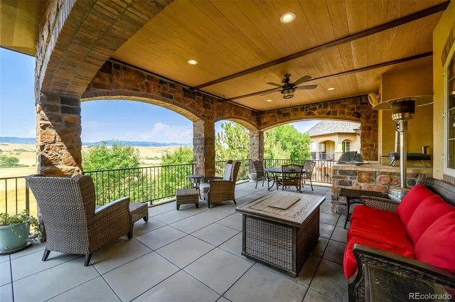 a outdoor living space with patio furniture and a potted plants