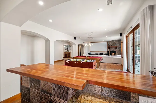 a kitchen with stainless steel appliances granite countertop a stove and a refrigerator