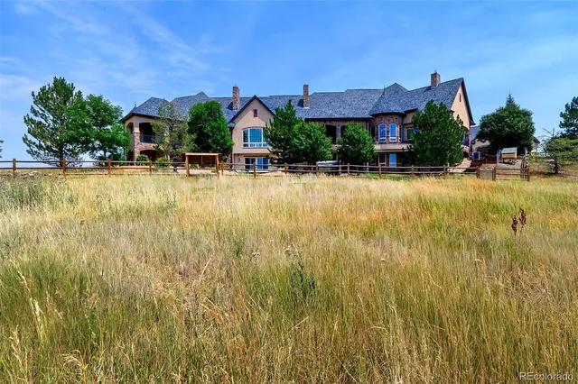 a view of a swimming pool and lounge chairs