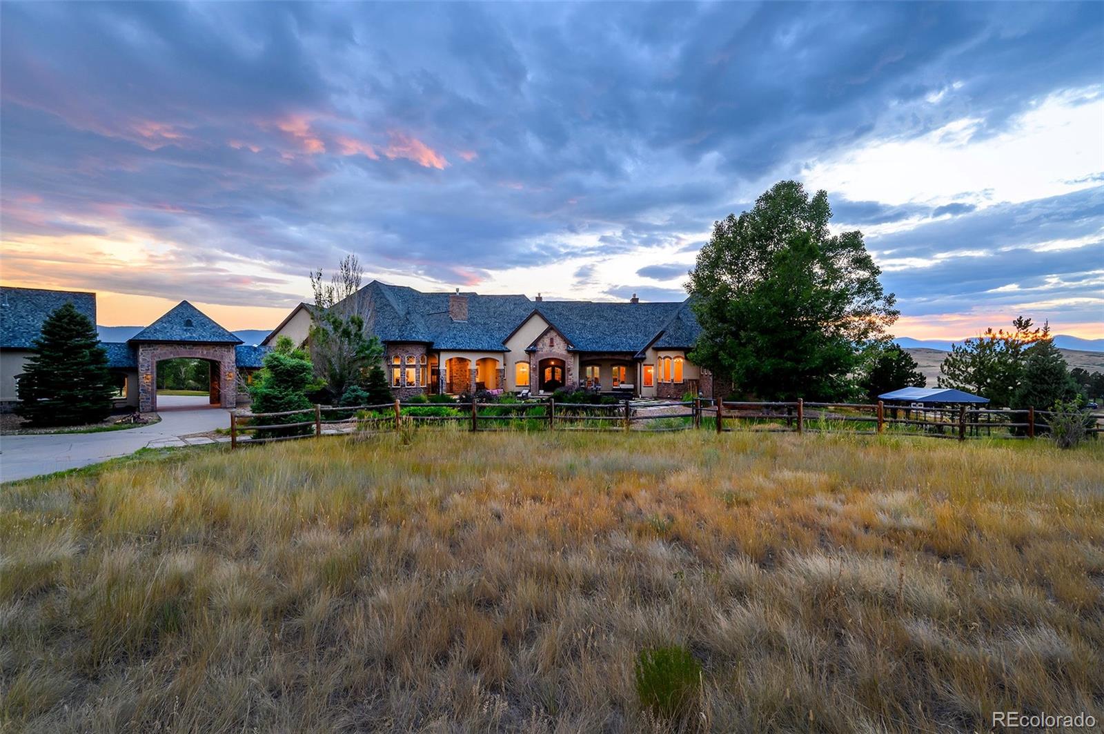 5740 Lambert Ranch Trail Sedalia, CO 80135 - Photo 42 of 48 a view of a swimming pool and lounge chairs