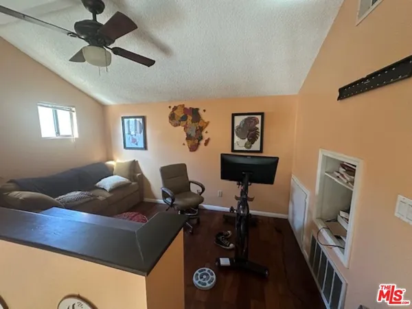 a view of living room with furniture and a large window