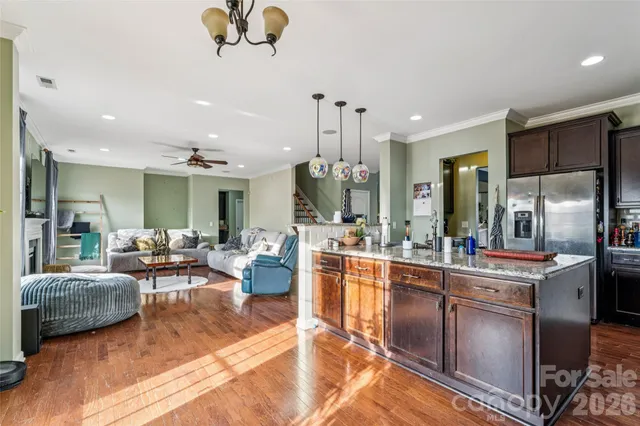 a large kitchen with a table and chairs