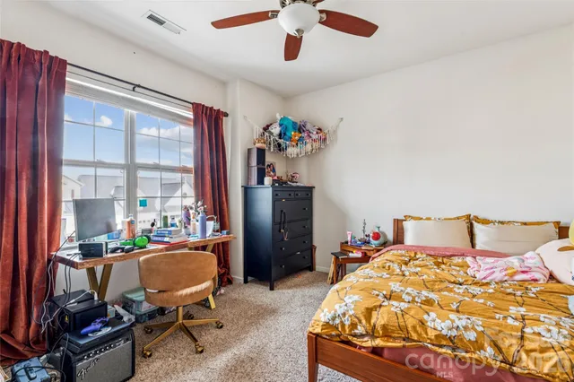 a bedroom with furniture and a couch