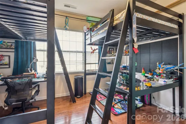 a view of a room with lots of stuff and furniture