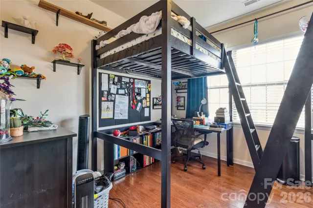 a view of a swimming pool with a lounge chair