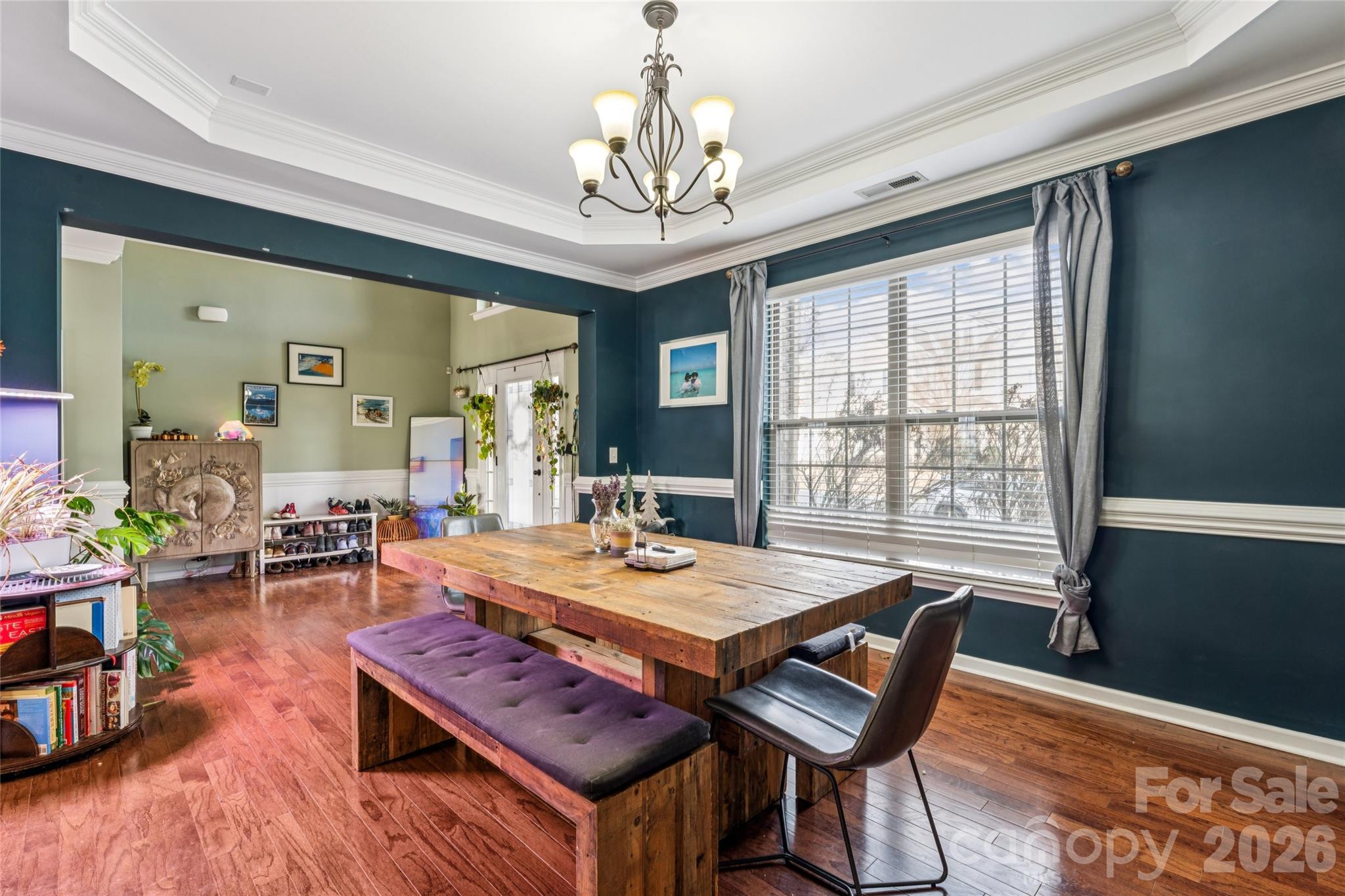 1276 Reflection Avenue Northwest Concord, NC 28027 - Photo 5 of 38 a view of a dining room with furniture window and wooden floor