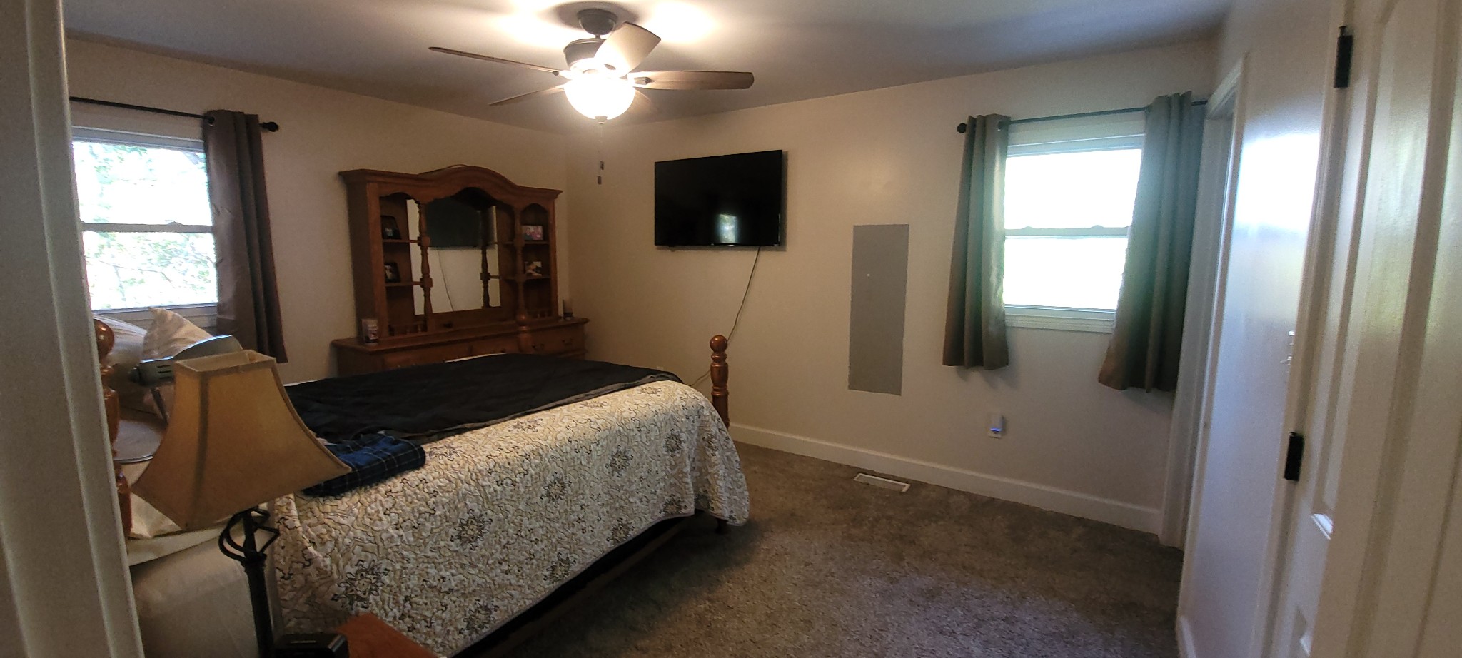 408 Sandy Road Dover, TN 37058 - Photo 17 of 32 a bedroom with a bed and a flat tv screen on dresser