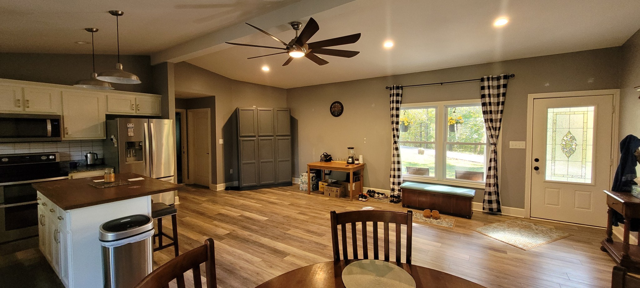 408 Sandy Road Dover, TN 37058 - Photo 5 of 32 a kitchen with sink refrigerator dining table and chairs