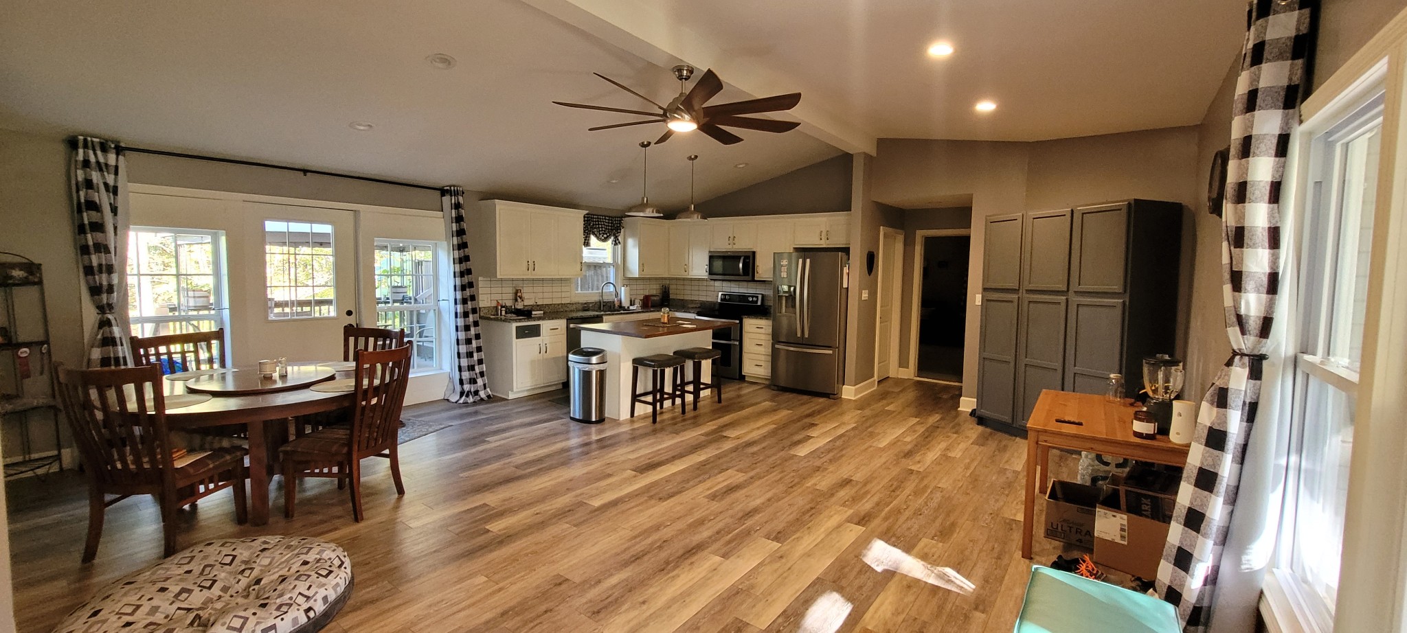 408 Sandy Road Dover, TN 37058 - Photo 9 of 32 a kitchen with stainless steel appliances a dining table chairs stove and refrigerator