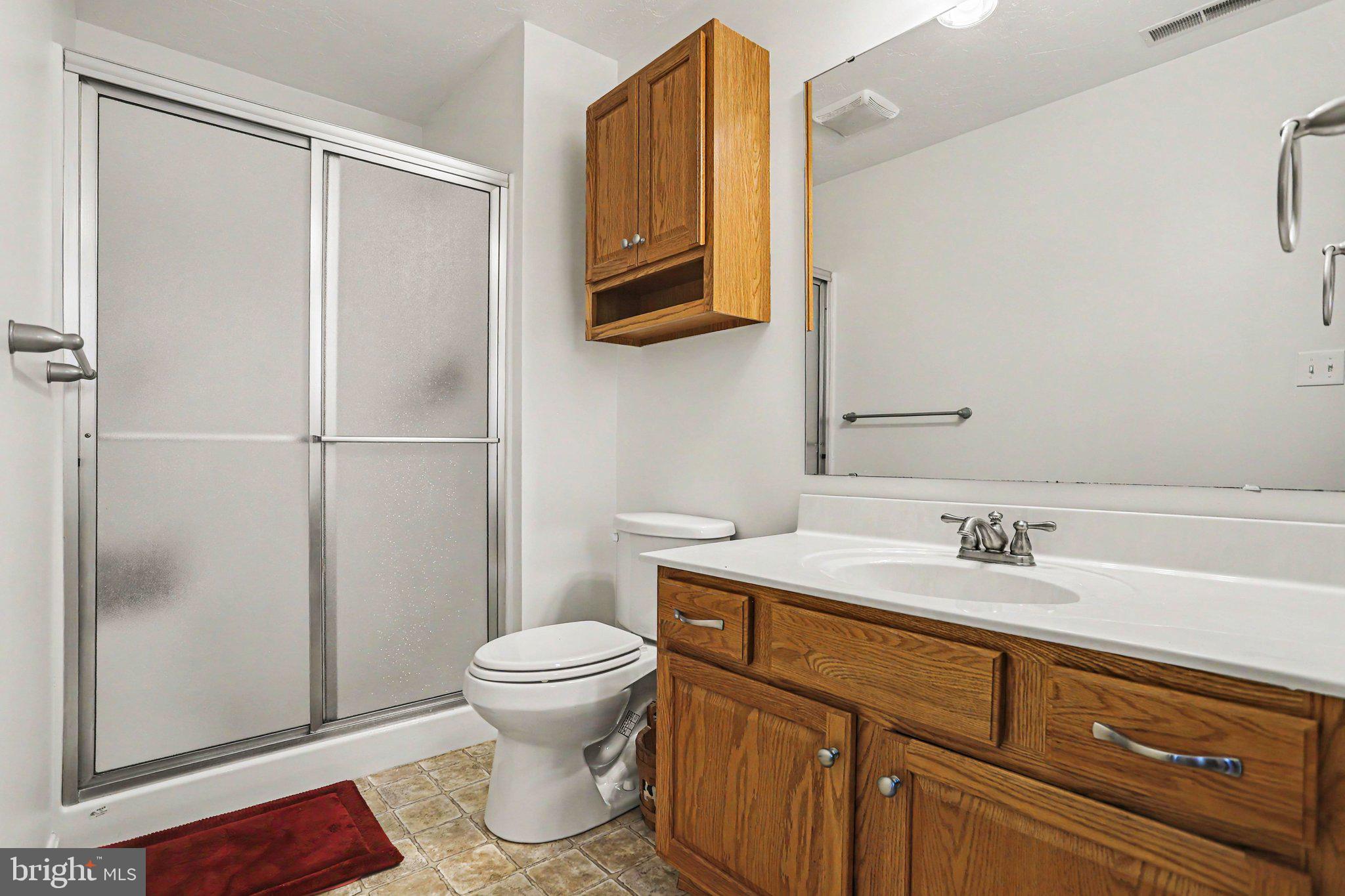 1371 Chami Drive, Unit 166 Spring Grove, PA 17362 - Photo 20 of 28 a bathroom with a sink a toilet and shower