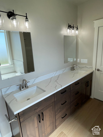 658 West 500 South Logan, UT 84321 - Photo 23 of 25 Full bath featuring double vanity and light wood-style flooring
