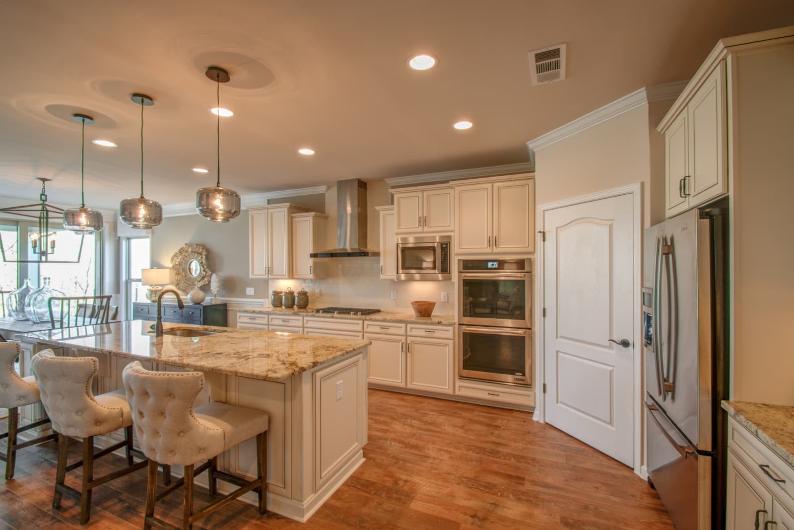 1103 Sumner Grove Spring Hill, TN 37174 - Photo 4 of 18 a kitchen with a refrigerator a sink and cabinets