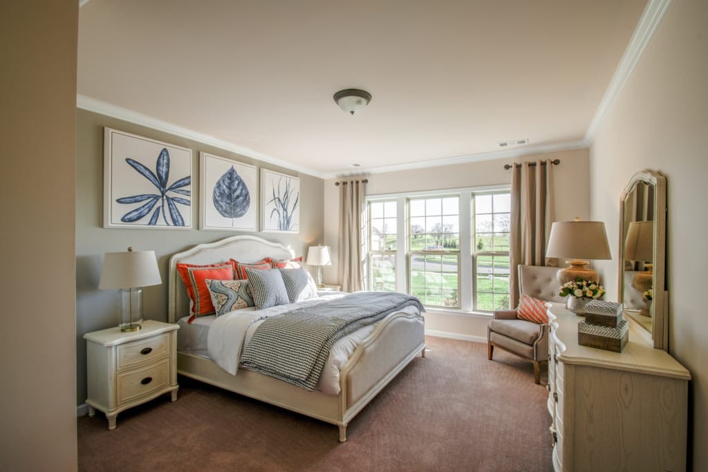 1103 Sumner Grove Spring Hill, TN 37174 - Photo 9 of 18 a bedroom with a bed and a couch