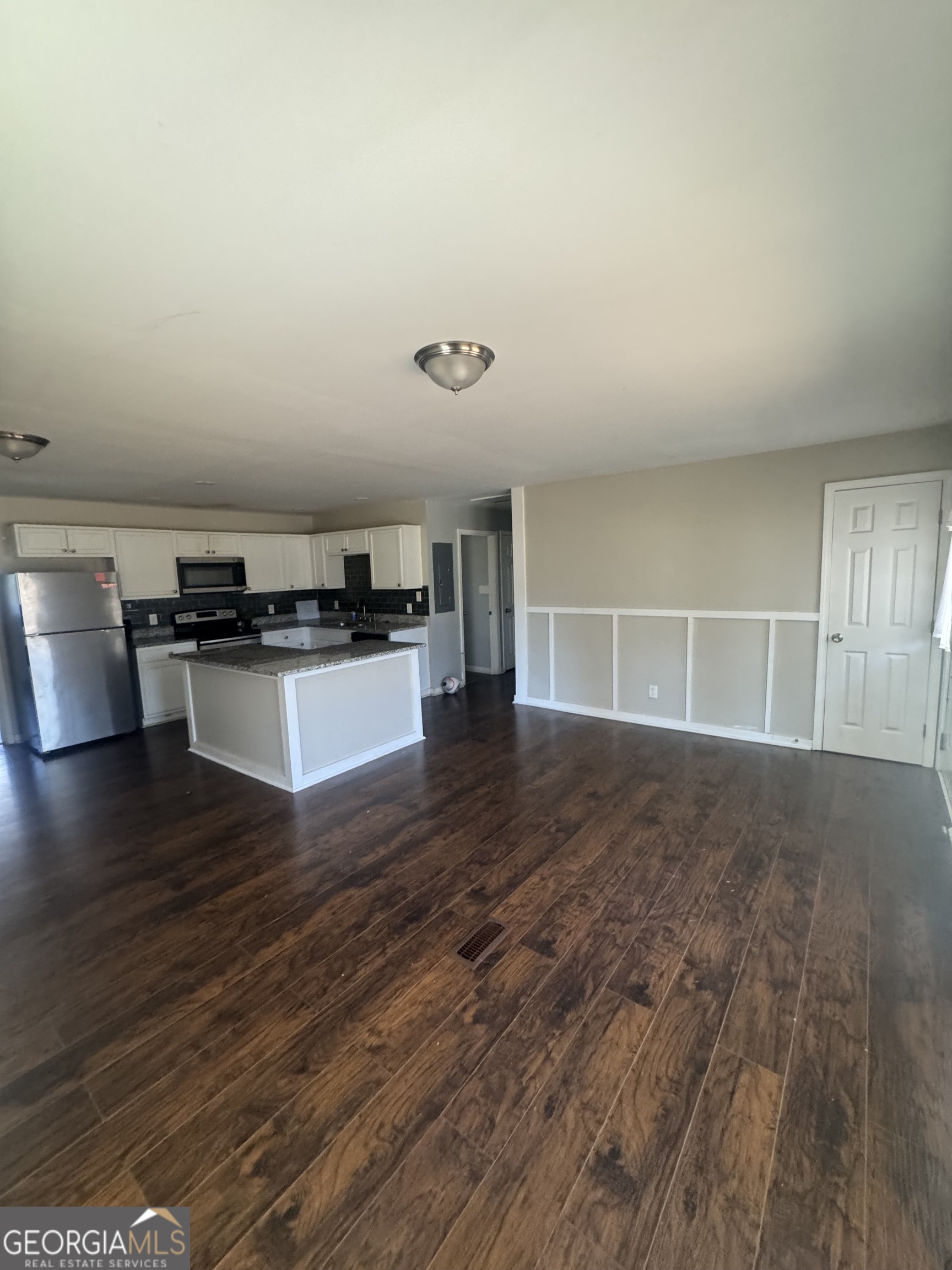 5205 Heather Lane Atlanta, GA 30349 - Photo 12 of 14 a view of a kitchen with wooden floor and a sink