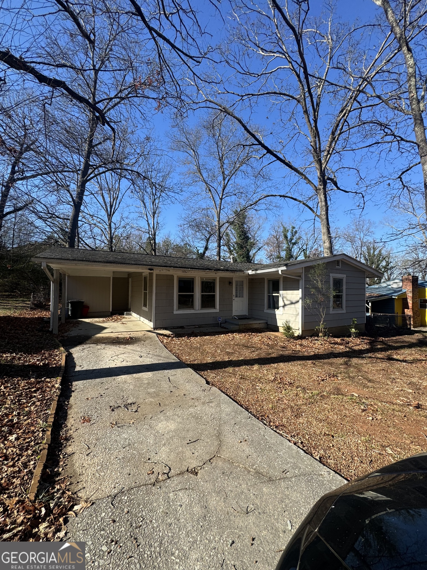 5205 Heather Lane Atlanta, GA 30349 - Photo 2 of 14 a front view of a house with a yard