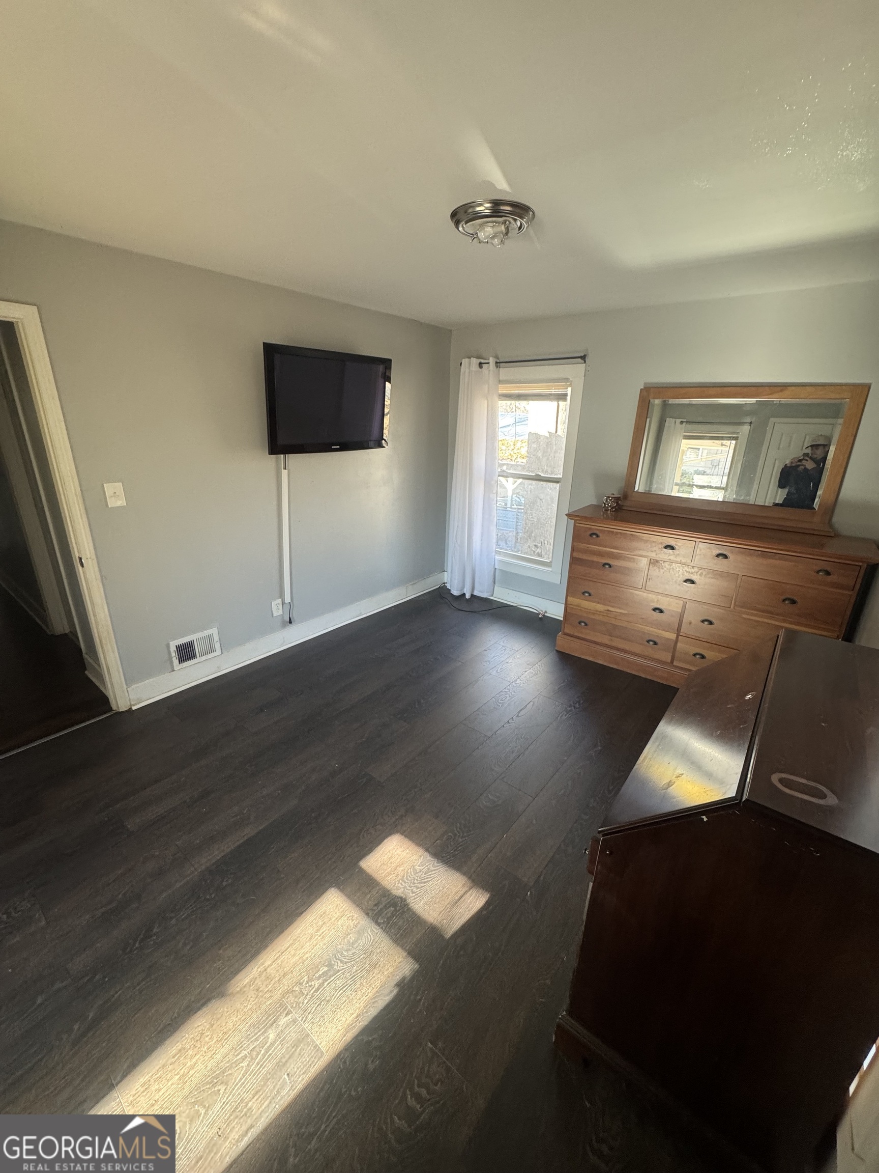5205 Heather Lane Atlanta, GA 30349 - Photo 3 of 14 a living room with furniture and a flat screen tv