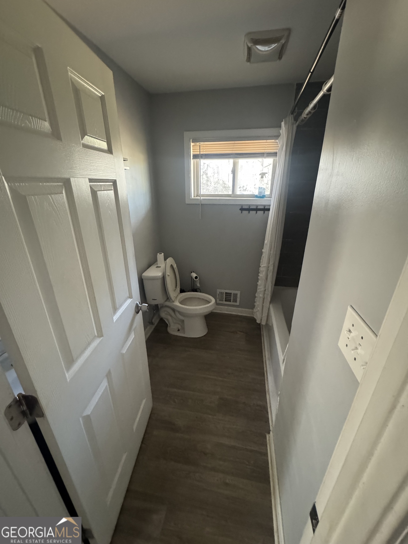 5205 Heather Lane Atlanta, GA 30349 - Photo 8 of 14 a bathroom with sink and mirror